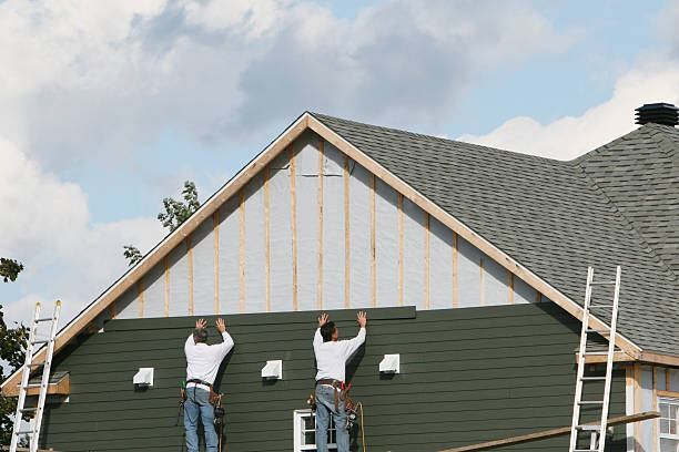 Professional Siding technician working in Manassas, VA